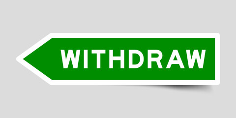Green color arrow shape sticker label with word withdraw on gray background