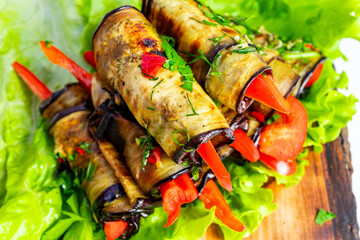 Grilled vegetable rolls with fresh parsley on crisp lettuce