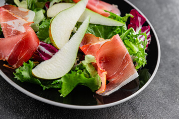 Salad pear ham vegetable dish fresh tasty gourmet food background on the table rustic food top view copy space