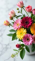 Fototapeta premium Vibrant mixed flowers arrangement on white marble table , interior, floral