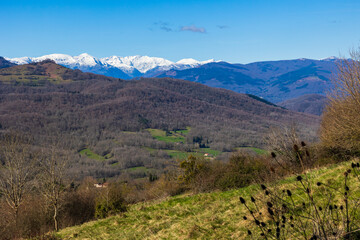 Panorama of Pic des Trois Seigneurs on the horizon and the Douctouyre Valley from the Ariège village of Roquefixade in spring