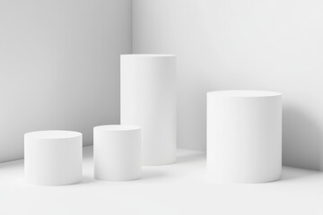 White cylinder display podiums in corner room