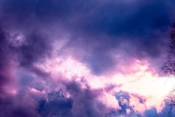 Fairy colourful sunset sky. Amazing view. Purple lilac clouds