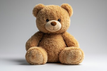 Obraz premium Cute fluffy teddy bear with a smile on neutral background