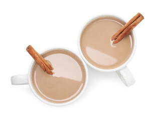 Aromatic Masala tea in cups and cinnamon isolated on white, top view