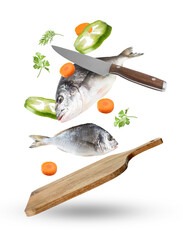 Cutting board, knife, fresh vegetables and raw fish in air on white background