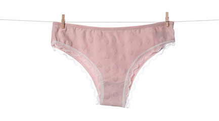 Beautiful panties on clothes line against white background