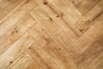 Natural wooden oak parquet flooring background. Rustic floor pattern for interior and indoor home design top view.