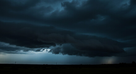 A brooding, ominous storm cloud descends upon the plains, a dramatic display of nature's power in deep, dark hues.
