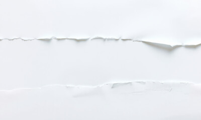 close up view of white paper background featuring torn edges, creating textured and layered appearance that adds depth and interest to composition