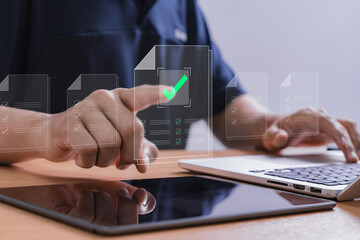 User interacting with digital document approval checklist on touchscreen interface, representing...