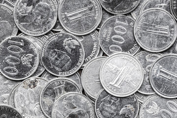 Indonesian Rupiah Coins Close-Up. Pile of Indonesian 1000 Rupiah Coins. Stack of penny coins