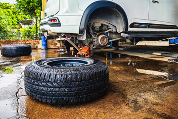 Change new car tires. Process of checking the condition of new tires. Repair tire puncture. Checking and filling air pressure. Car repairs. Car breakdowns. Concept of car tire maintenance and repair