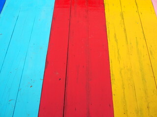 Colorful planks, ideal for background images, with different bright colors. The planks are in a row and each one is painted in a different vibrant shade