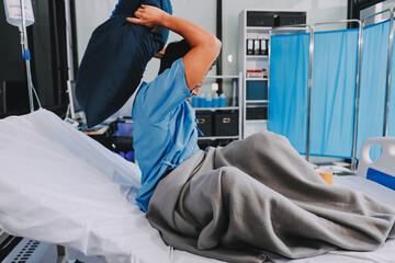 Lonely man silhouette sitting on the bed feeling depressed and stressed in the dark bedroom, Depression and anxiety disorder concept