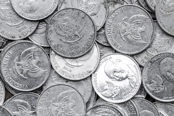 Pile of Indonesian 1000 Rupiah Coins. Reverse view of Indonesian Rupiah Coins in Close-Up