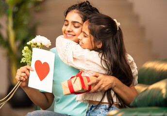 Emotional moment as Indian mother hugs her daughter, receiving a special Mother's Day greeting