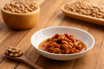 salted soya beans,fermented whole soybeans in white plate