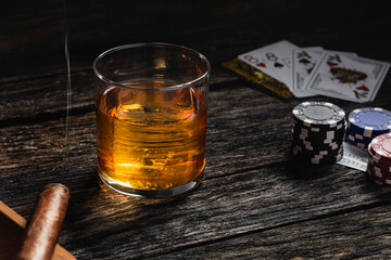 Bourbon in a glass on old wood table