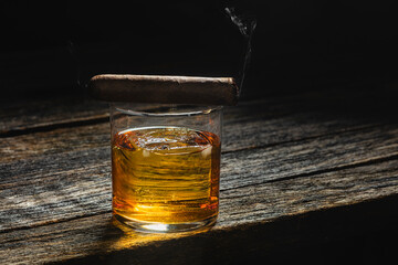 Bourbon in a glass on old wood table