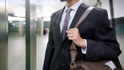 An office worker enters the company building to go to work.