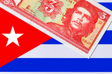 3 Pesos of Cuba with a portrait of Ernesto Che Guevara on the background of the Cuban flag. Vintage...