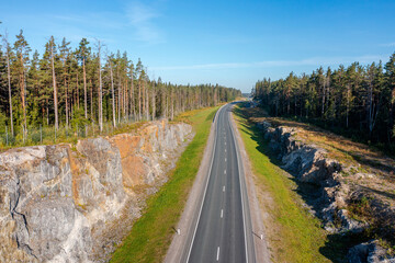 Nature of Karelia. Roads in Russia. High-speed route to lake Ladoga. Road among coniferous forest....