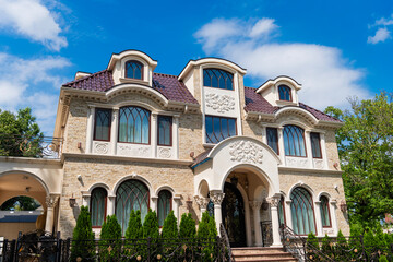 Suburb exterior with housing property. Suburban neighborhood. Private family home property. House exterior architecture. Private house in suburban area. Suburban house architecture. House exterior