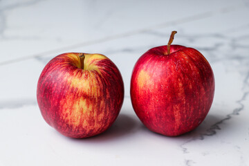 Two Red Apples Placed Close to Each Other