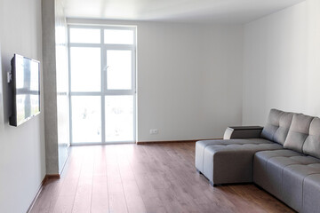 Modern living room with cozy furniture and ample natural light