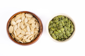 Delicious pumpkin seeds on white background