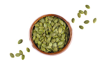 Delicious pumpkin seeds on white background