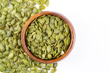Delicious pumpkin seeds on white background