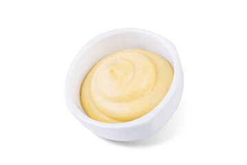 Creamy mustard sauce in a bowl on a white isolated background