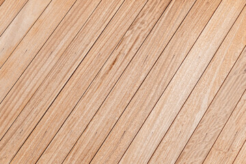 Fototapeta premium a clean and evenly spaced wooden surface. The wood planks are laid diagonally. aesthetic is warm and minimalistic.