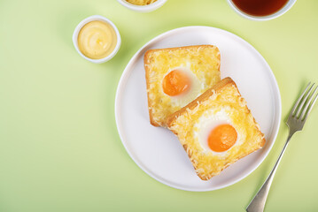 Sandwich with egg and cheese in a plate