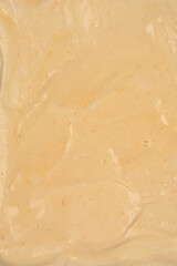 The smooth surface of light-colored unbaked sponge cake batter is ready for baking