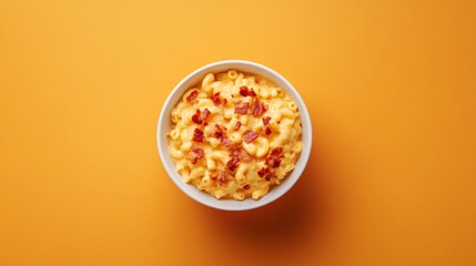 A bowl of creamy mac and cheese with crispy bacon bits. Featuring indulgence and comfort