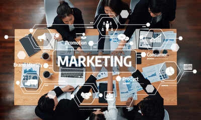 A high-angle view of a marketing strategy meeting showcasing professionals collaborating on...