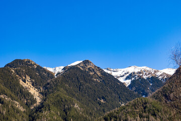Obraz premium Snow-capped alpine mountains under clear blue sky, Ötztal, Austria, 20 March 2025..