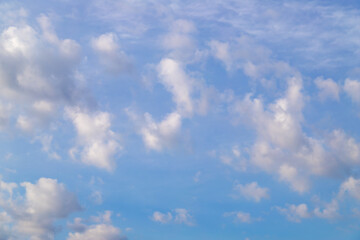 Blue Sky with Scattered Fluffy White Clouds on a Clear Day