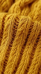 Fototapeta premium Detailed Close Up of a Knitted Wool Fabric in a Warm Mustard Yellow Tone Capturing Softness and Texture for Fashion and Design Projects