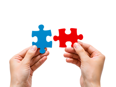 Two hands holding a blue and a red puzzle piece before connecting, symbolizing teamwork and solutions.