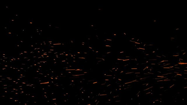Sparks flying from a fire or welding