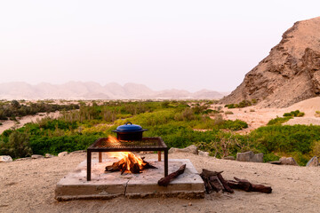 Fireplace with Dutch Oven against vast African Landscape, Damaraland, Namibia