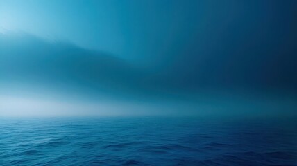 Obraz premium A dark blue ocean with a few waves