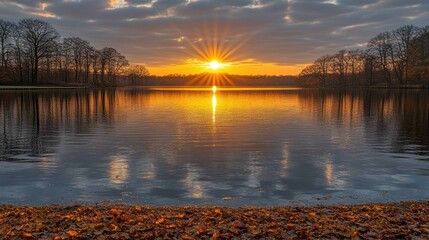 Majestic Sunset Over Serene Lake with Autumnal Hues