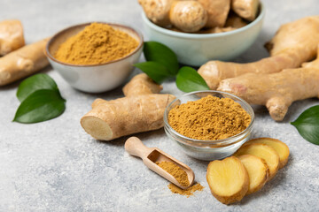 Fresh ginger on wooden background. Dry ginger. Sliced ​​ginger with honey and lemon. Ginger root. Traditional alternative medicine, healing tea for immunity. Seasoning and spices concept. Copy space.