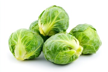 Fototapeta premium Pile of Fresh Green Brussels Sprouts on White Background Close Up