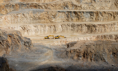 Behind the Mediterranean coastline, the slopes reveal detailed soil layers and formations,...